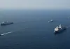 "Brink of War in the Strait of Hormuz: Iran Issues 'Contact' Ultimatum to Ships, Claims Strike on US Aircraft Carrier"